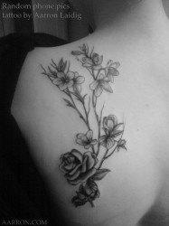 pretty blackwork flowers tattoo by Aarron Laidig