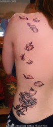 rose petals falling tattoo 