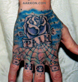 pain hand rose tattoo