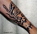 It's a snake, and flames, and couds, and its a tattoo