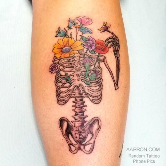 skeleton with no head tattoo done in Port Angeles at Red Region Luna Gallery Tattoo Port Angeles, Wa