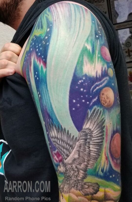 Northern Lights shoulder cap tattoo by Aarron Laidig Port Angeles Wa